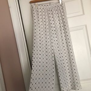 White flare pants with navy blue print design